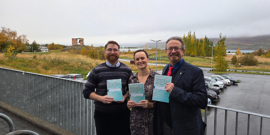 The photo shows Romain, Rachael and Giorgio with copies of the book